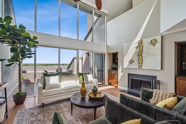 a view of living room with furniture and a large window