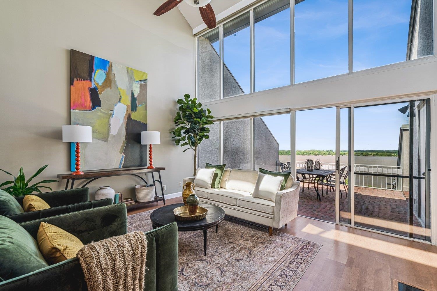 335 Riverbluff Place, Unit 2 Memphis, TN 38103 - Photo 6 of 21 a living room with furniture and a floor to ceiling window