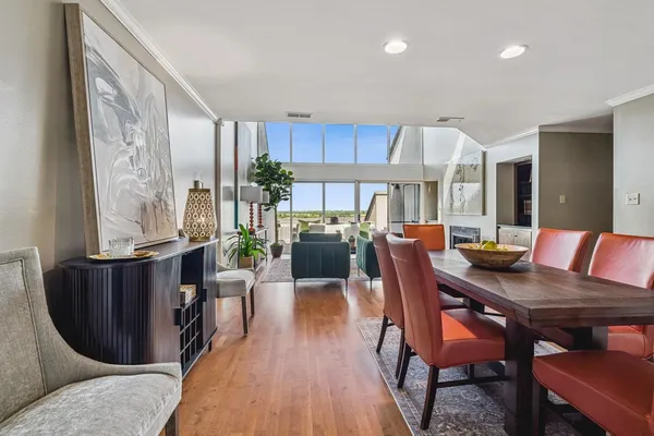 a kitchen with granite countertop a sink appliances cabinets and dining table