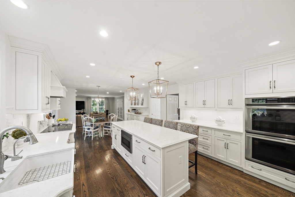 48 Lexington Circle Holden, MA 01520 - Photo 11 of 42 a large white kitchen with lots of counter space a sink and appliances