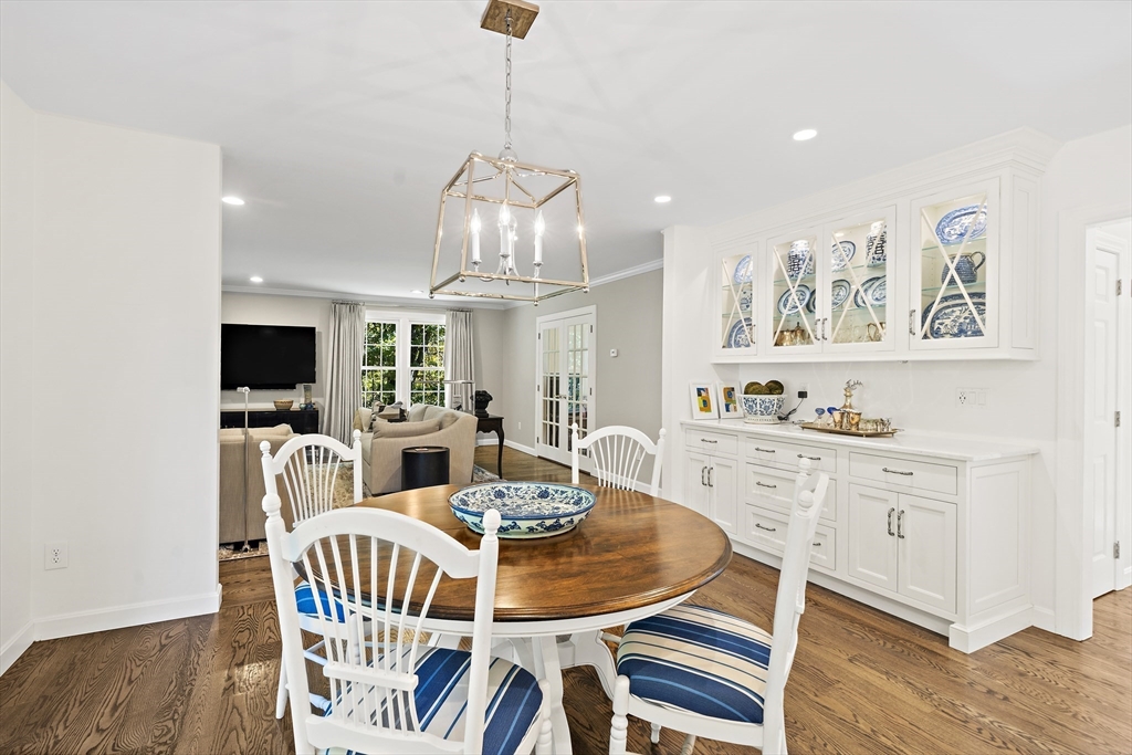48 Lexington Circle Holden, MA 01520 - Photo 13 of 42 a view of a dining room with furniture a chandelier and wooden floor