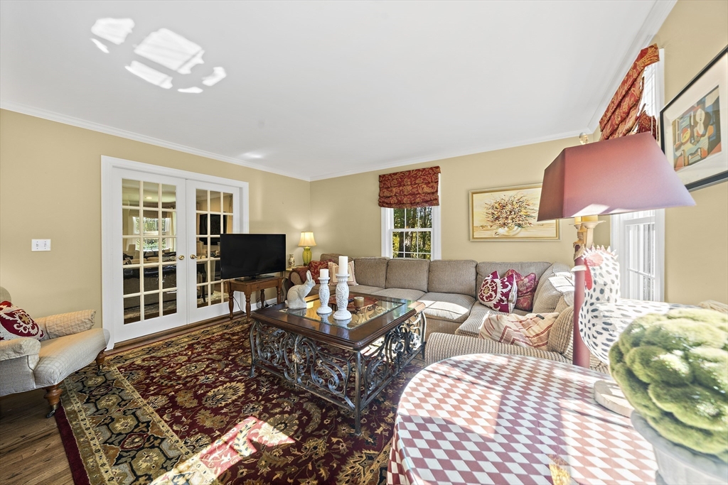 48 Lexington Circle Holden, MA 01520 - Photo 20 of 42 a living room with furniture and a flat screen tv