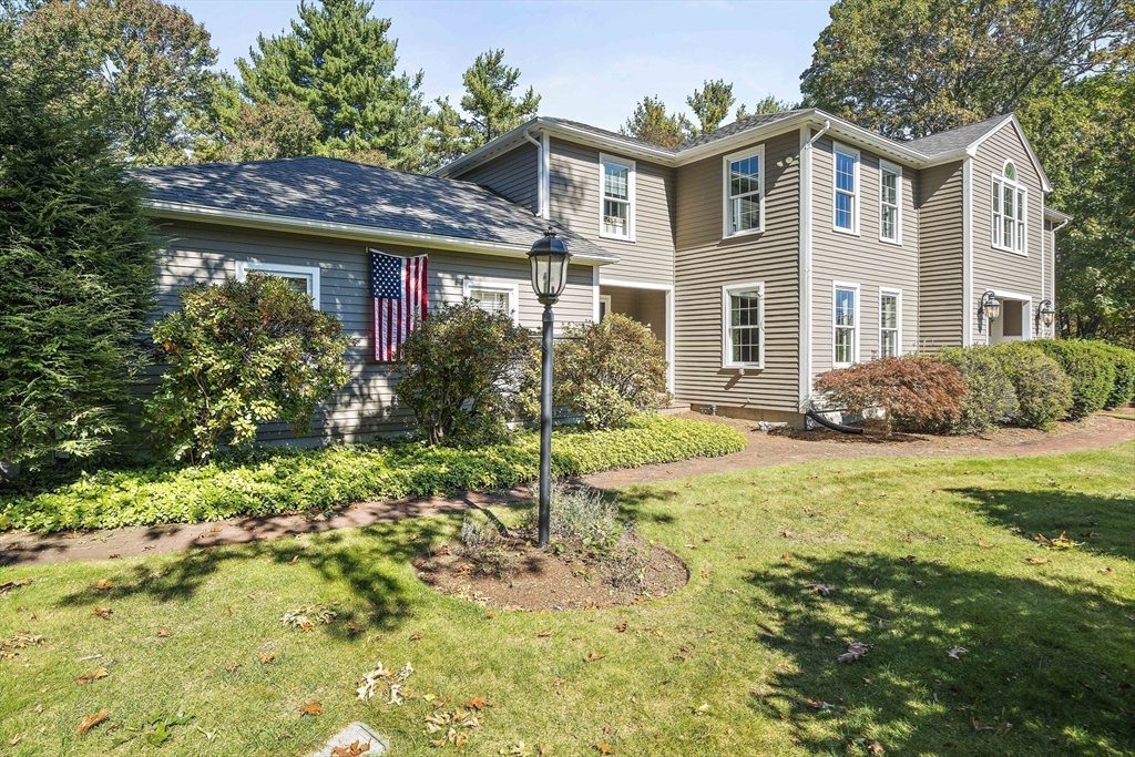 48 Lexington Circle Holden, MA 01520 - Photo 2 of 42 a front view of a house with garden