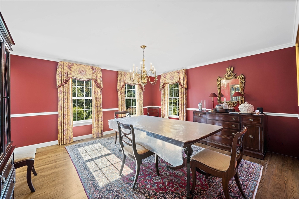 48 Lexington Circle Holden, MA 01520 - Photo 23 of 42 a view of a dining room with furniture window and wooden floor