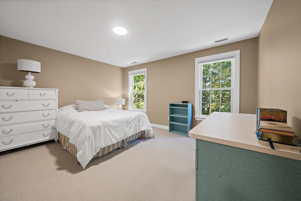 48 Lexington Circle Holden, MA 01520 - Photo 28 of 42 a spacious bedroom with a bed and window