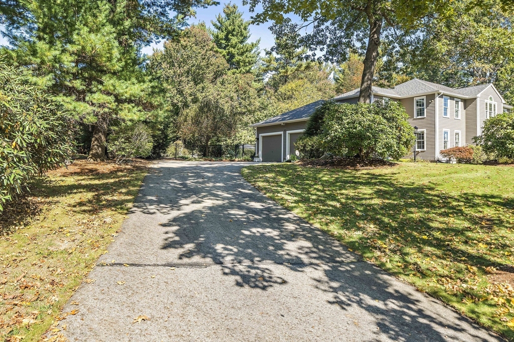 48 Lexington Circle Holden, MA 01520 - Photo 3 of 42 a front view of a house with a yard and trees