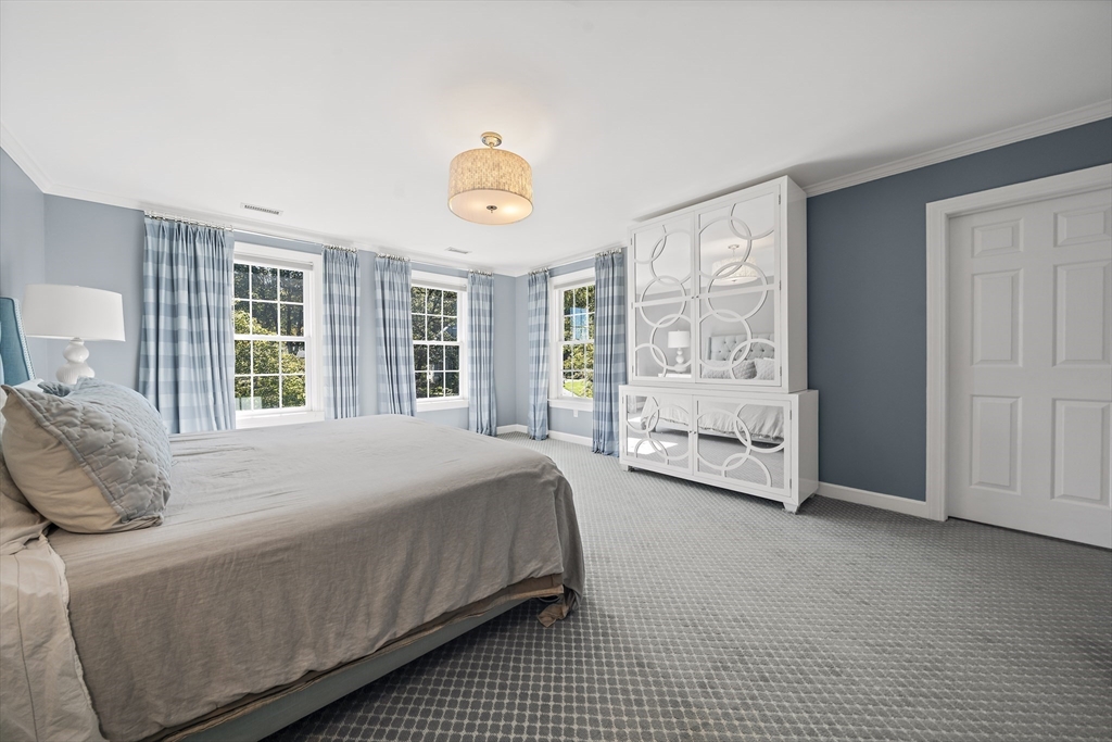 48 Lexington Circle Holden, MA 01520 - Photo 31 of 42 a spacious bedroom with a bed and a large window