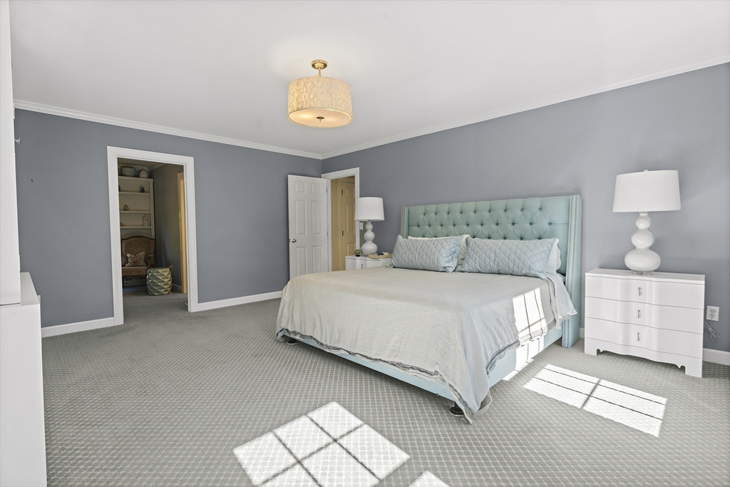 48 Lexington Circle Holden, MA 01520 - Photo 32 of 42 a bedroom with a bed and a table