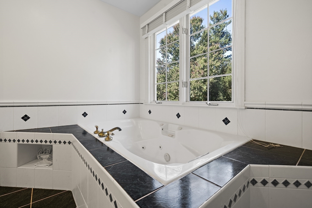 48 Lexington Circle Holden, MA 01520 - Photo 35 of 42 a bathroom with a bathtub and a window