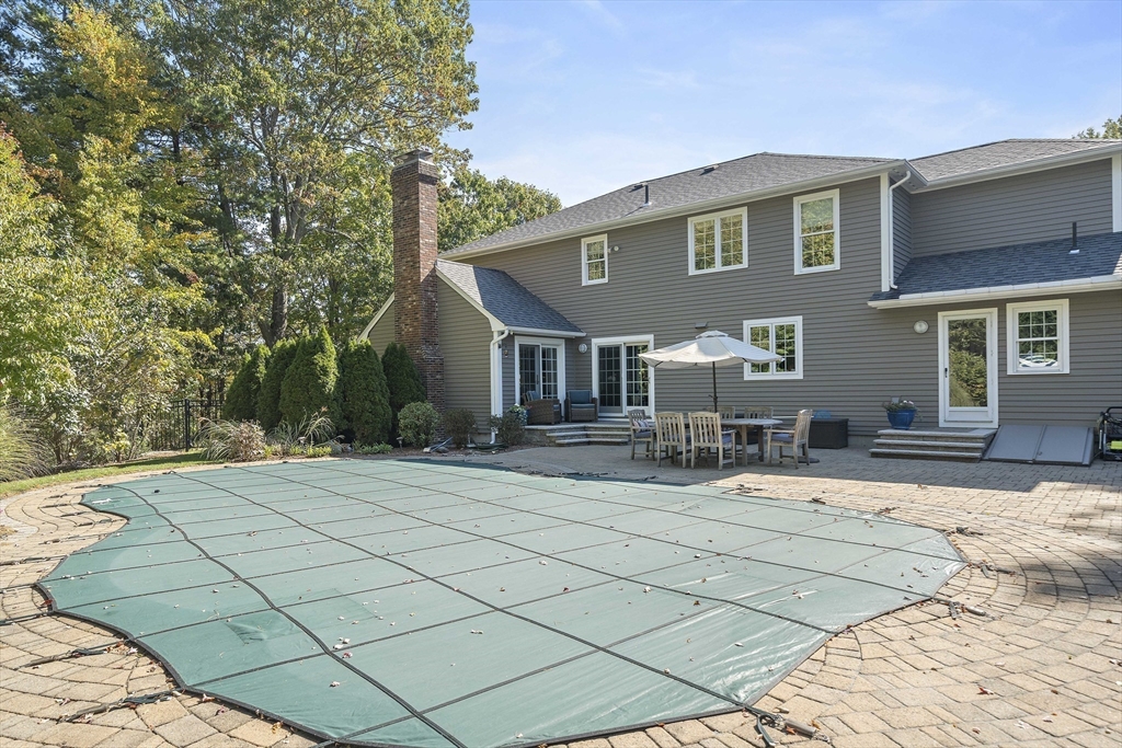 48 Lexington Circle Holden, MA 01520 - Photo 39 of 42 a front view of a house with chairs and tables