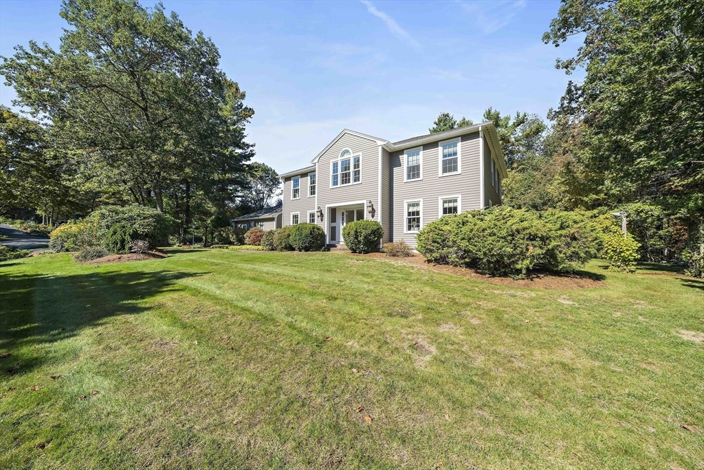 48 Lexington Circle Holden, MA 01520 - Photo 4 of 42 a front view of a house with a yard