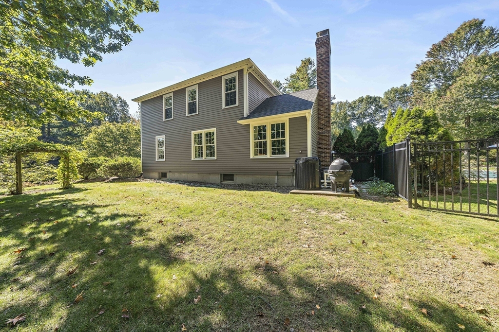 48 Lexington Circle Holden, MA 01520 - Photo 41 of 42 a front view of house with yard and trees around