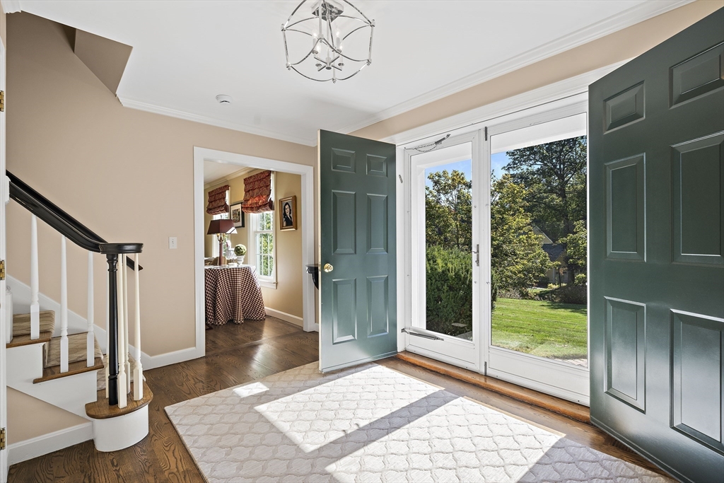 48 Lexington Circle Holden, MA 01520 - Photo 5 of 42 a view of a hallway to a livingroom with furniture wooden floor and window