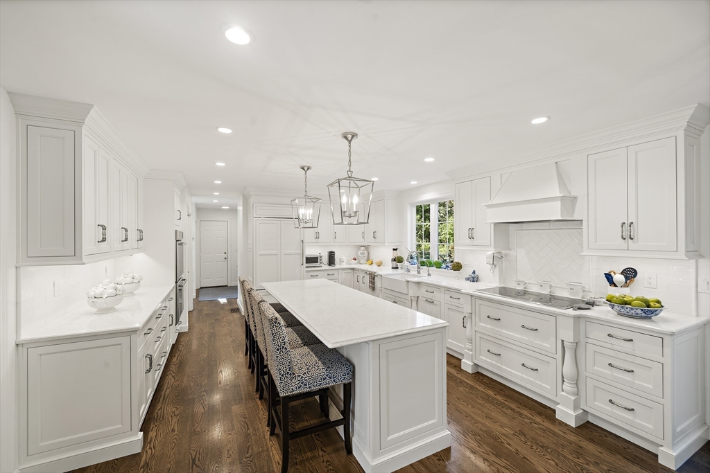 48 Lexington Circle Holden, MA 01520 - Photo 7 of 42 a large kitchen with kitchen island white cabinets and stainless steel appliances
