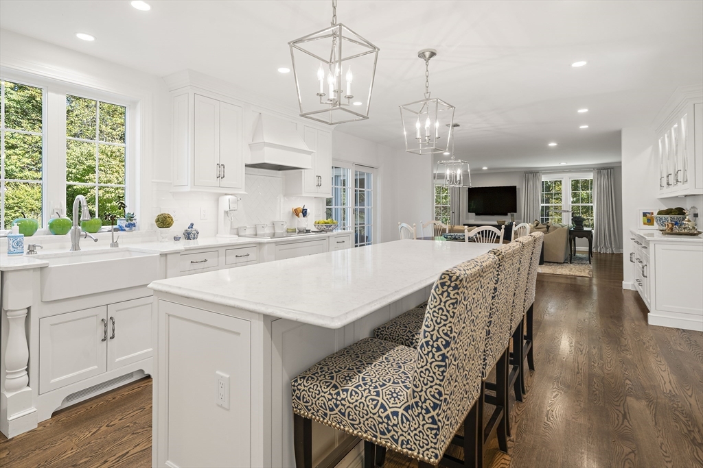 48 Lexington Circle Holden, MA 01520 - Photo 8 of 42 a kitchen with a table chairs sink and microwave