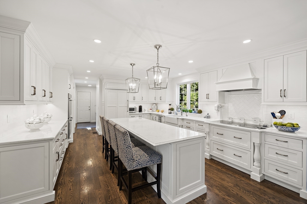 48 Lexington Circle Holden, MA 01520 - Photo 9 of 42 a large kitchen with kitchen island white cabinets and stainless steel appliances