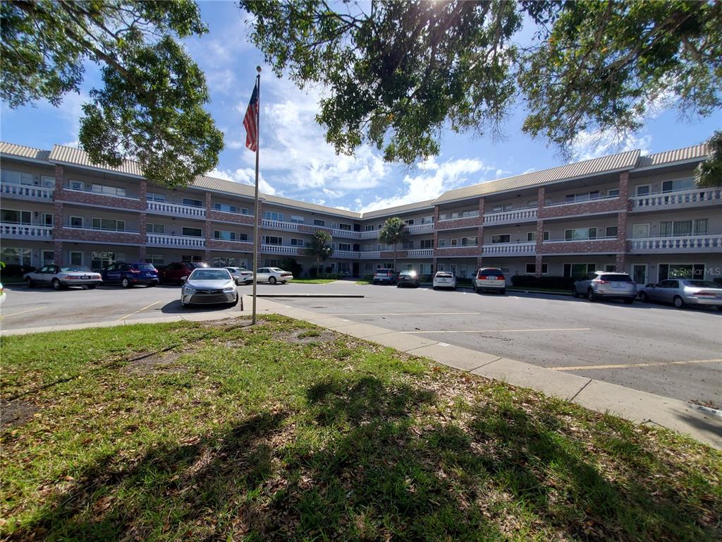 a swimming pool view with a outdoor seating