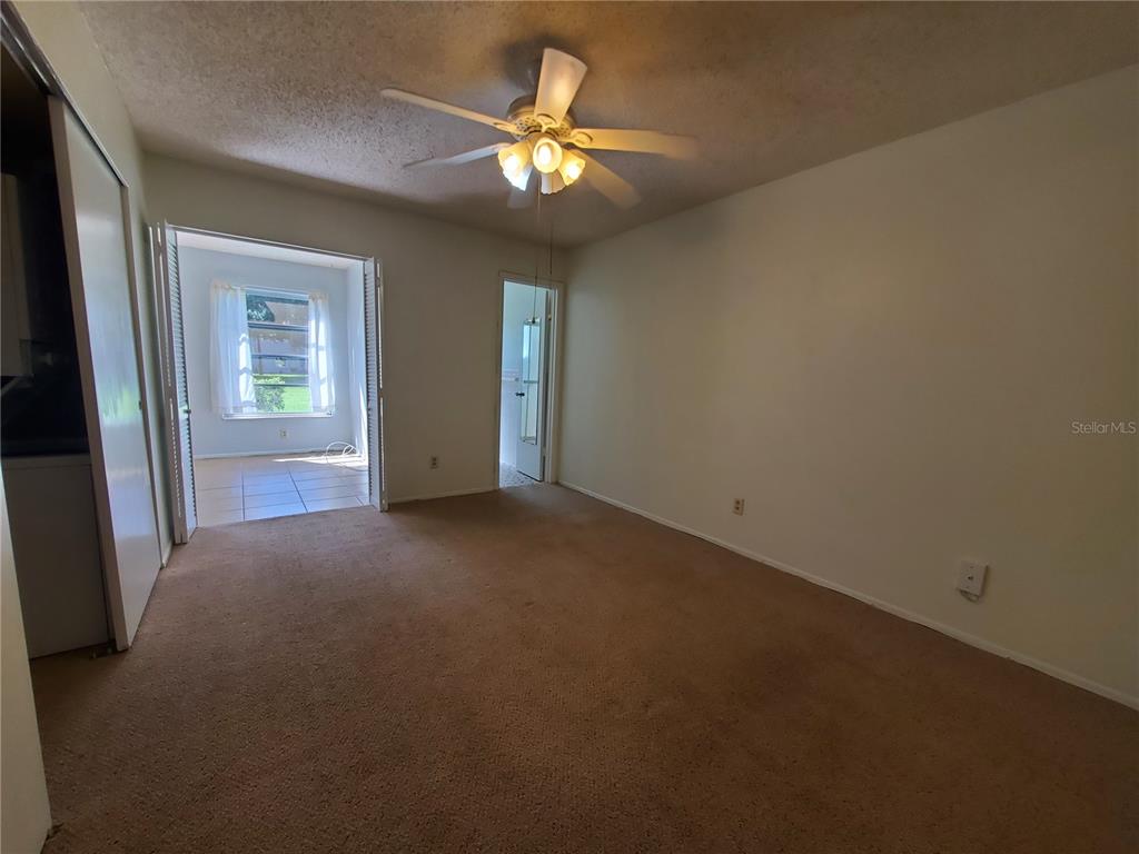 2461 Rhodesian Drive, Unit 19 Clearwater, FL 33763 - Photo 11 of 28 a view of an empty room with a window