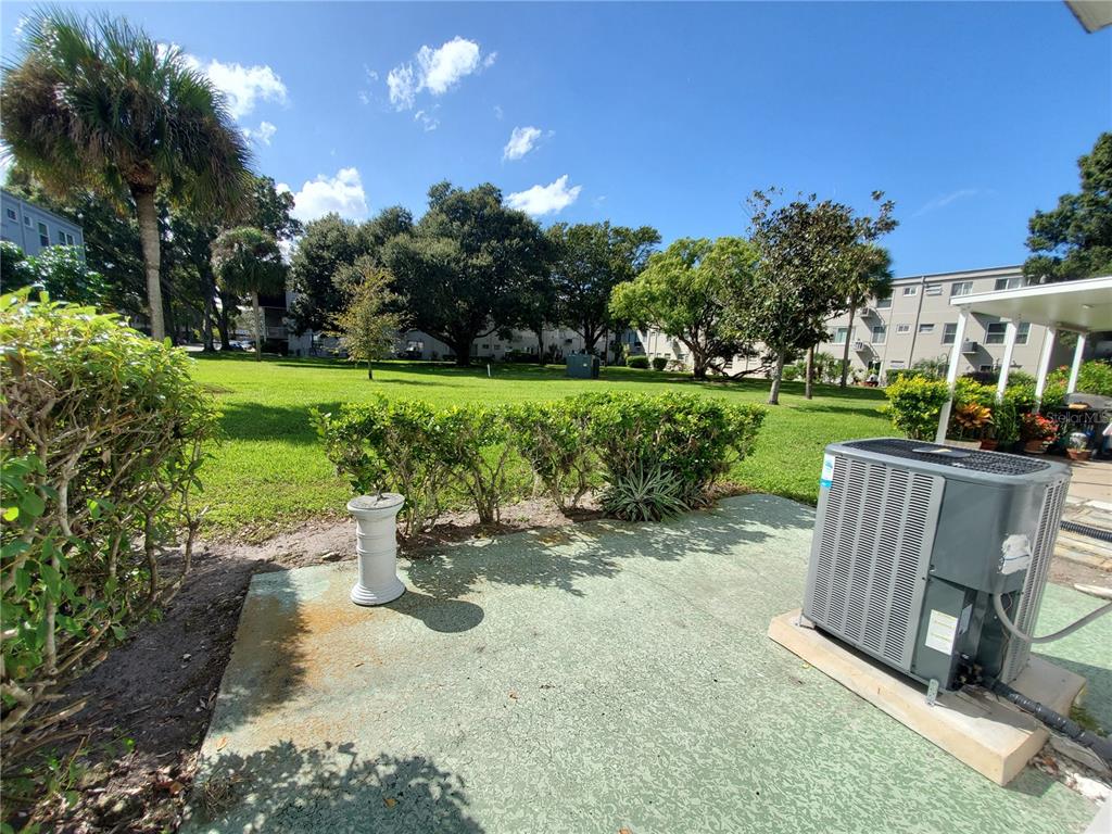2461 Rhodesian Drive, Unit 19 Clearwater, FL 33763 - Photo 18 of 28 a view of a table and chairs in the garden