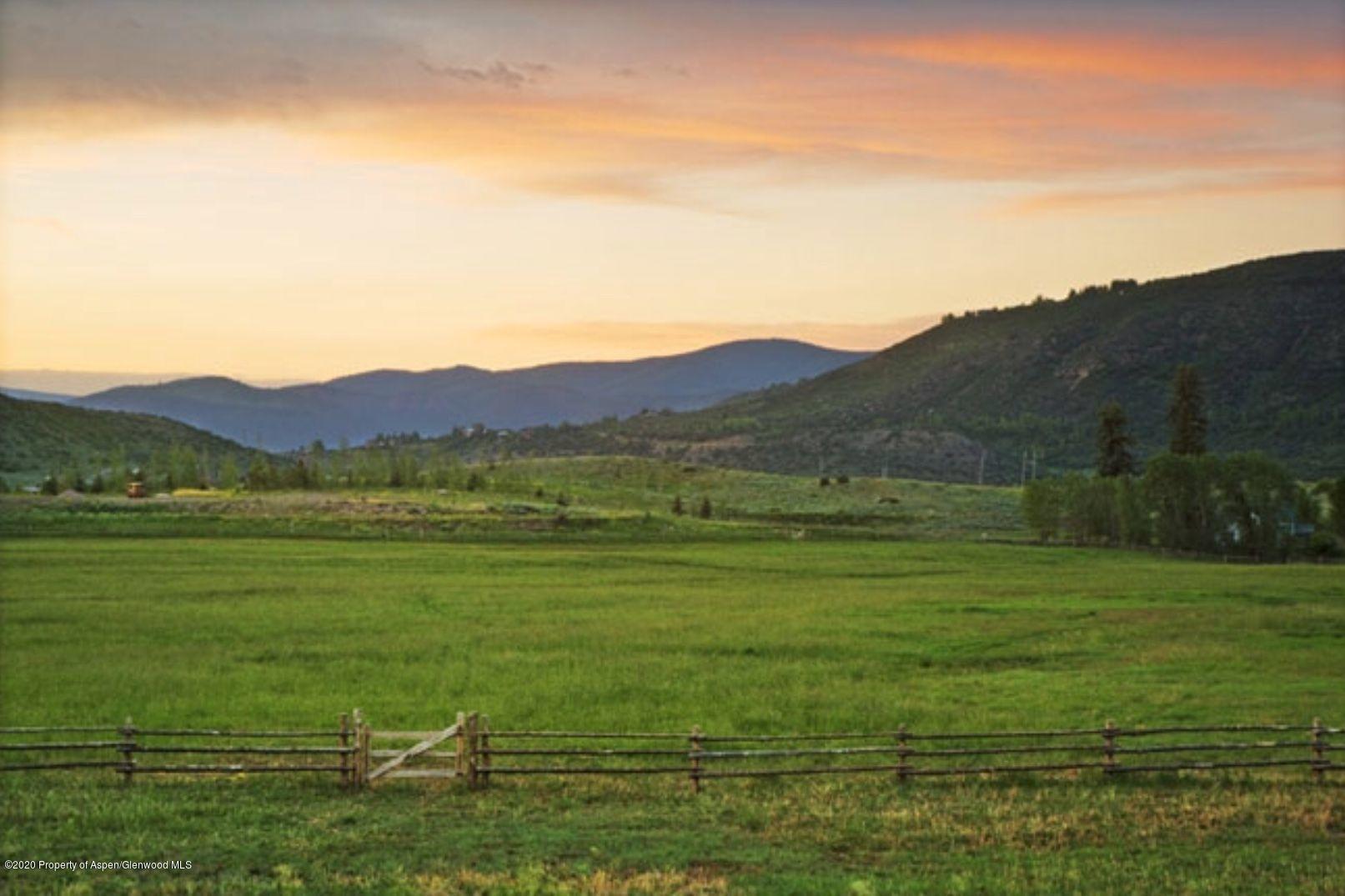 360 Coach Road Aspen, CO 81611 - Photo 6 of 33 a view of a grassy area with an ocean
