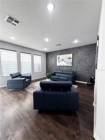 a living room with couches and a couch