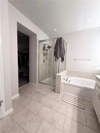 a bathroom with a bathtub and shower