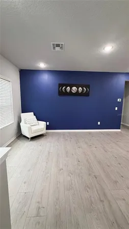 a view of an empty room with windows