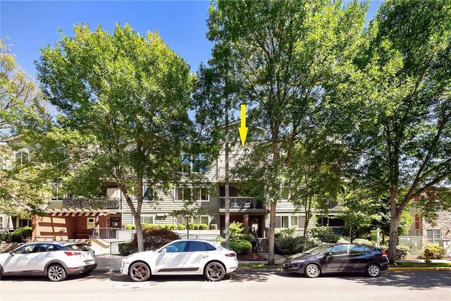 a view of parking with cars parked