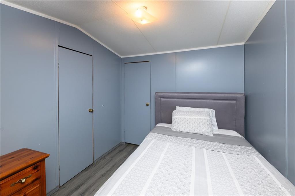 36338 Marshall Hutts Road Rio Hondo, TX 78583 - Photo 18 of 42 a bedroom with a bed and a dresser