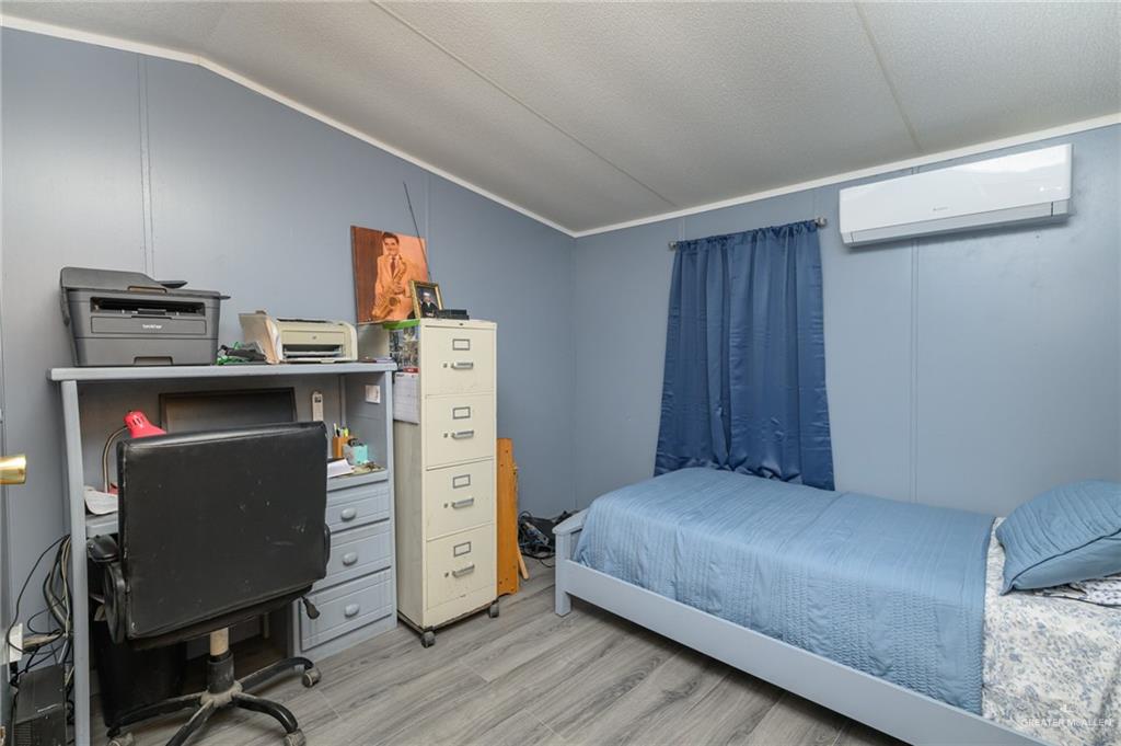 36338 Marshall Hutts Road Rio Hondo, TX 78583 - Photo 21 of 42 a bedroom with a bed and cabinets