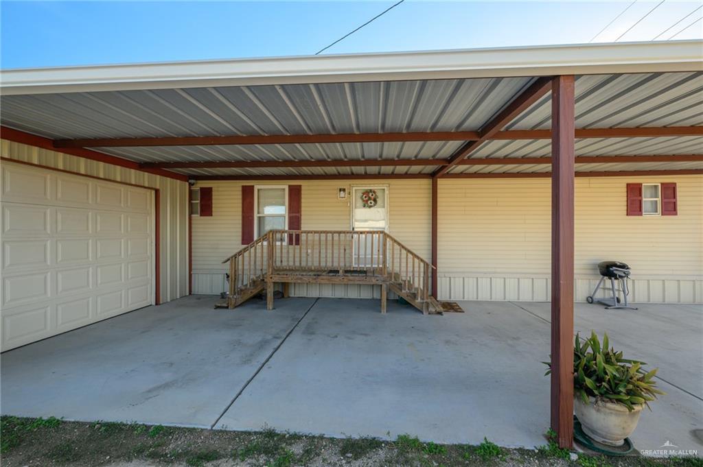 36338 Marshall Hutts Road Rio Hondo, TX 78583 - Photo 32 of 42 a view of a room with wooden floor and windows