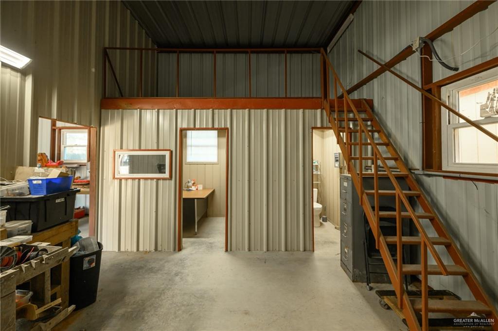 36338 Marshall Hutts Road Rio Hondo, TX 78583 - Photo 34 of 42 a view of an empty room with wooden floor and windows
