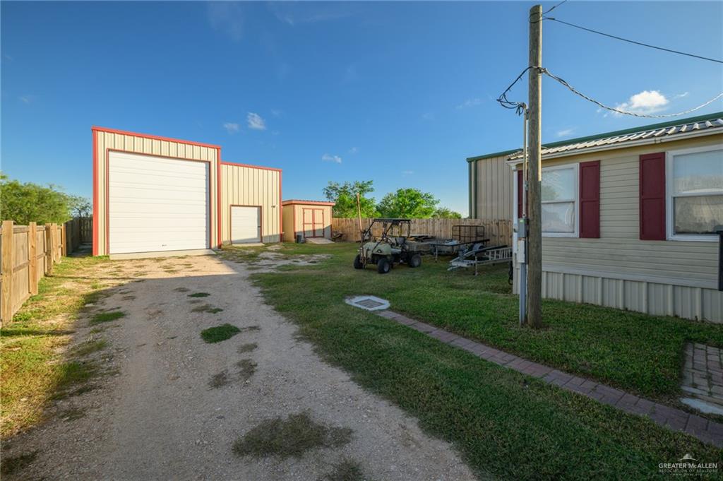 36338 Marshall Hutts Road Rio Hondo, TX 78583 - Photo 40 of 42 a view of a house with backyard and garden
