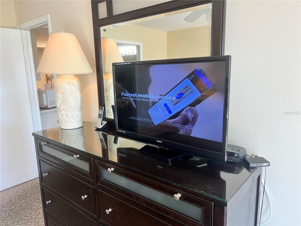 1001 Point Of Rocks Road, Unit 309 Sarasota, FL 34242 - Photo 13 of 38 a room with chairs and window