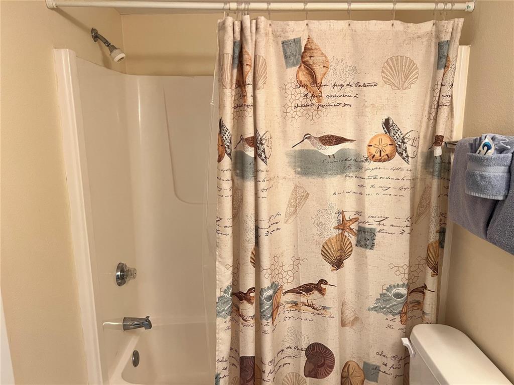 1001 Point Of Rocks Road, Unit 309 Sarasota, FL 34242 - Photo 20 of 38 a bathroom with a shower and a toilet