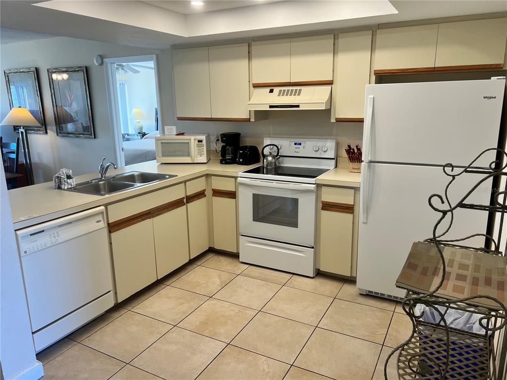 1001 Point Of Rocks Road, Unit 309 Sarasota, FL 34242 - Photo 4 of 38 a kitchen with a sink cabinets and appliances