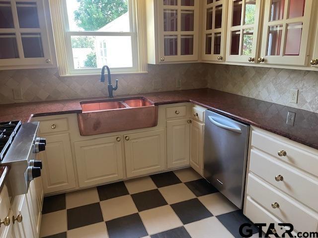 114 East 2nd Street Tyler, TX 75701 - Photo 11 of 48 a kitchen with a black white checkered floor and a sink