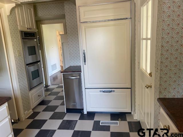 114 East 2nd Street Tyler, TX 75701 - Photo 12 of 48 a view of a refrigerator with wooden floor