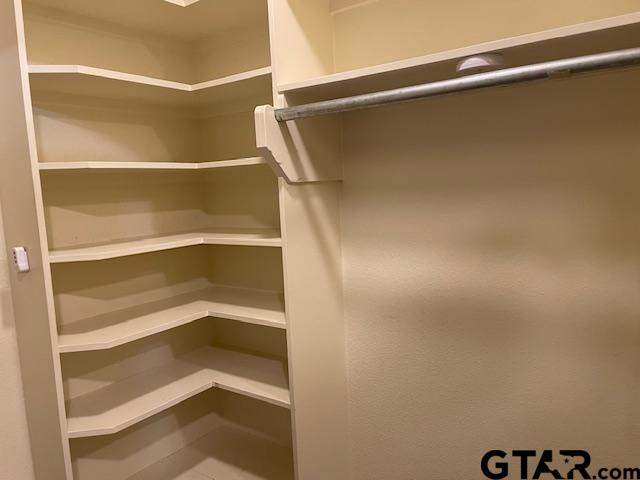 114 East 2nd Street Tyler, TX 75701 - Photo 30 of 48 a view of walk in closet with empty racks