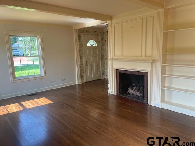 114 East 2nd Street Tyler, TX 75701 - Photo 4 of 48 a view of a livingroom with wooden floor a fireplace and windows