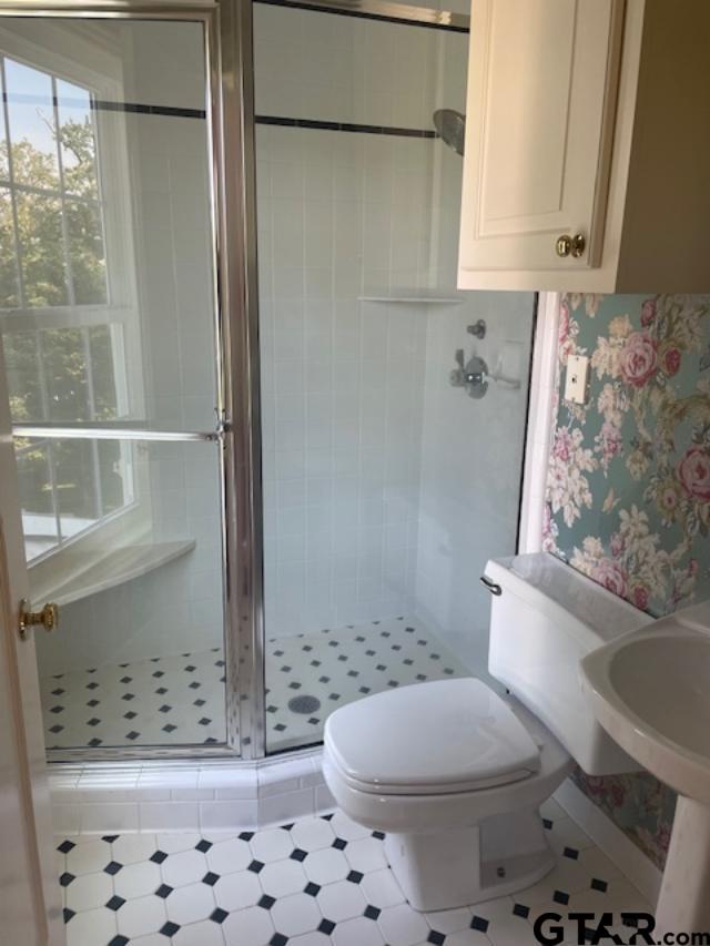 114 East 2nd Street Tyler, TX 75701 - Photo 41 of 48 a bathroom with a toilet and a shower