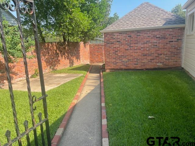 114 East 2nd Street Tyler, TX 75701 - Photo 45 of 48 a view of a backyard with an outdoor space