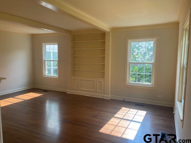 114 East 2nd Street Tyler, TX 75701 - Photo 5 of 48 a view of an empty room with wooden floor and a window