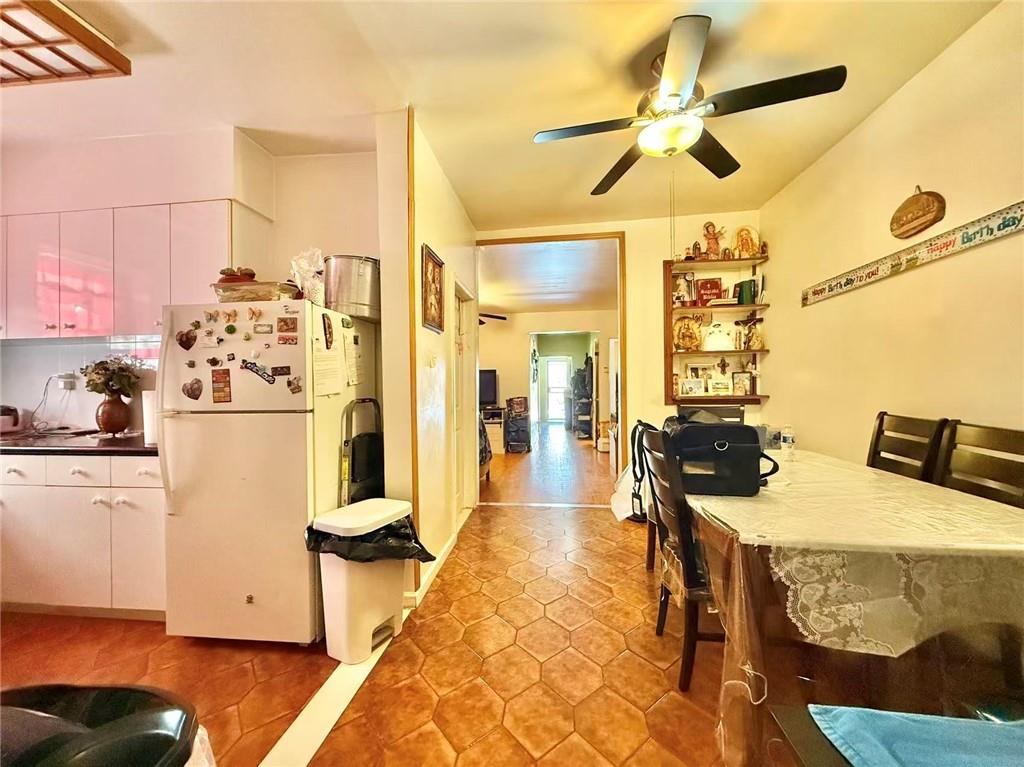 1876 Bay Ridge Avenue Brooklyn, NY 11204 - Photo 11 of 12 a kitchen with stainless steel appliances kitchen island granite countertop a refrigerator and a stove