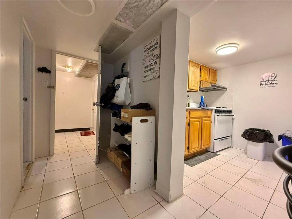 1876 Bay Ridge Avenue Brooklyn, NY 11204 - Photo 3 of 12 a view of kitchen and empty room with windows