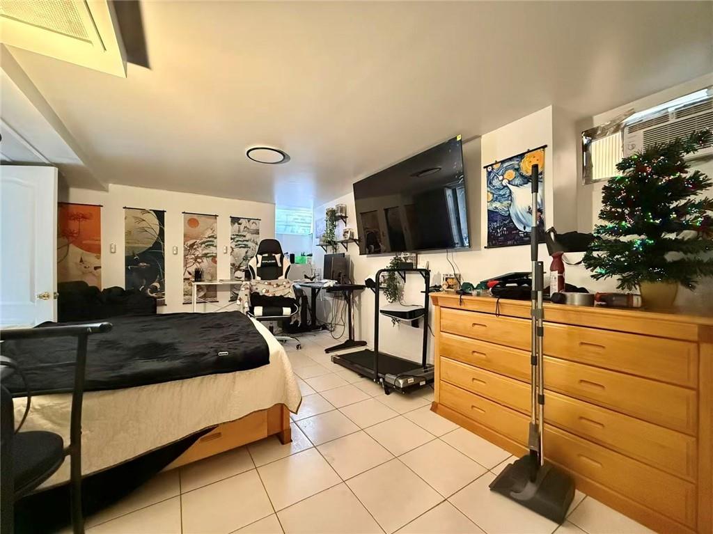1876 Bay Ridge Avenue Brooklyn, NY 11204 - Photo 4 of 12 a living room with furniture and a flat screen tv