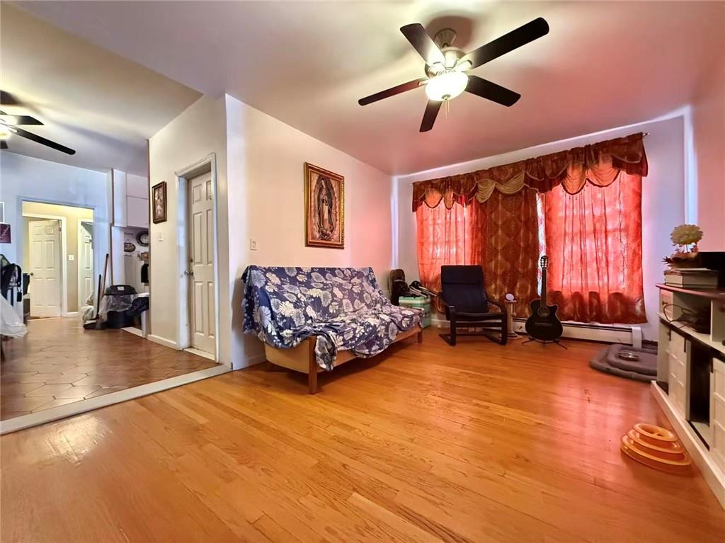 1876 Bay Ridge Avenue Brooklyn, NY 11204 - Photo 7 of 12 a living room with furniture and a large window