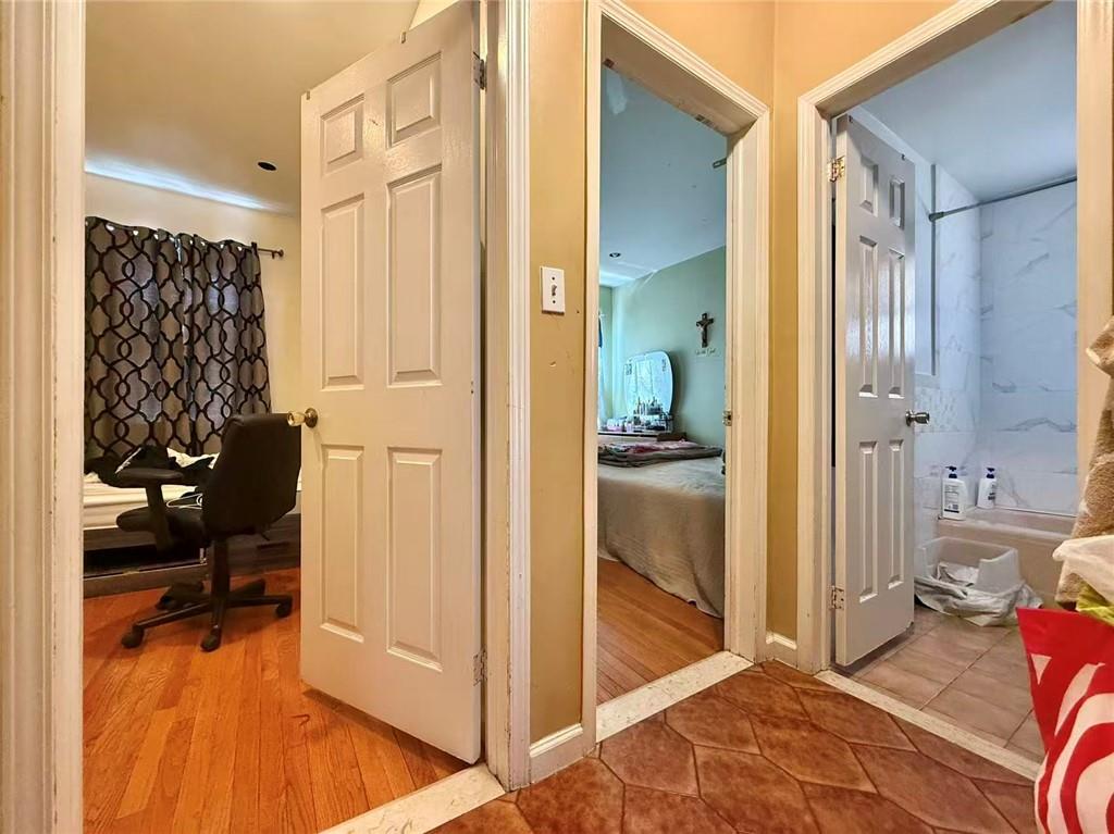 1876 Bay Ridge Avenue Brooklyn, NY 11204 - Photo 8 of 12 a bathroom with a tub and shower