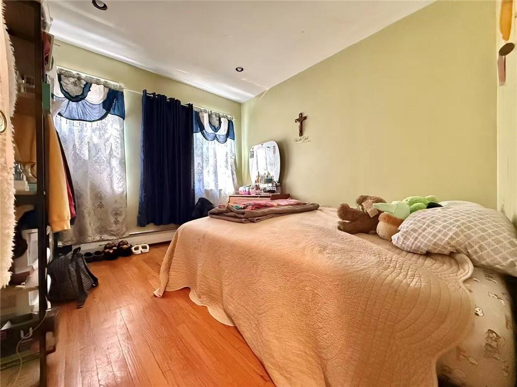 1876 Bay Ridge Avenue Brooklyn, NY 11204 - Photo 9 of 12 a bedroom with a bed and a window