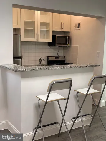 a kitchen with a stove and a microwave